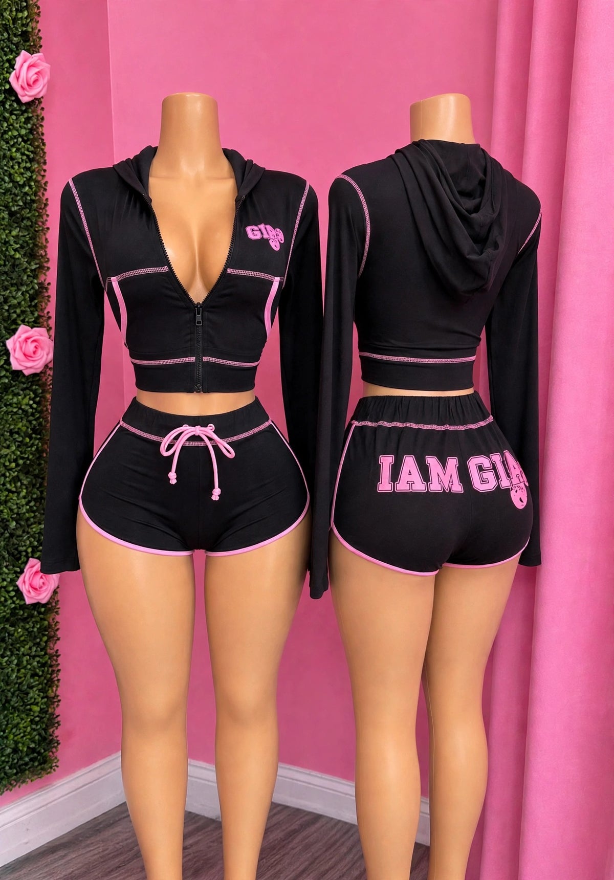 Cherry On Top — This black two-piece set pairs a zip-up jacket with hot pink outlining and matching shorts