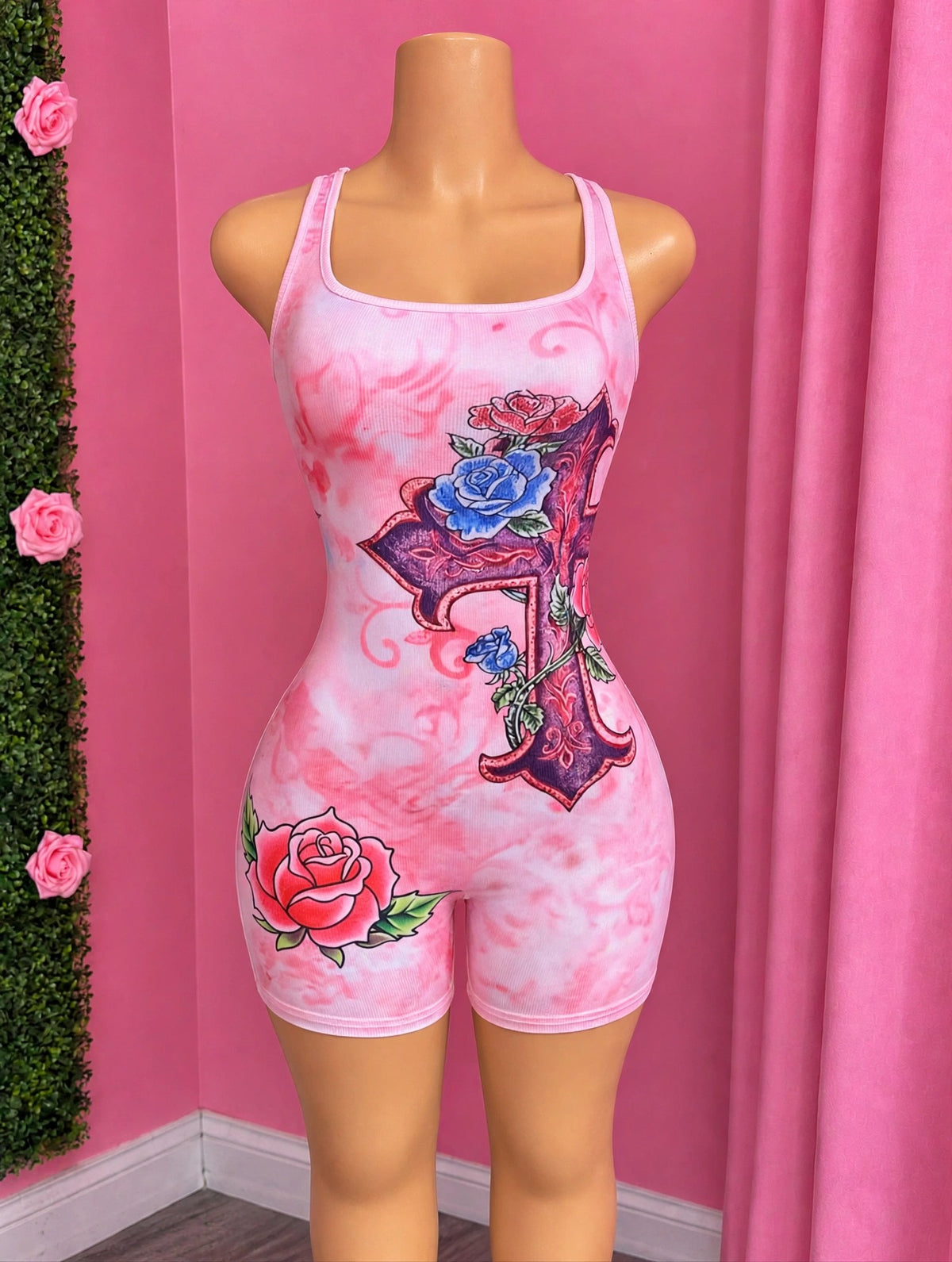 PINK VENOM pink cross romper on mannequin